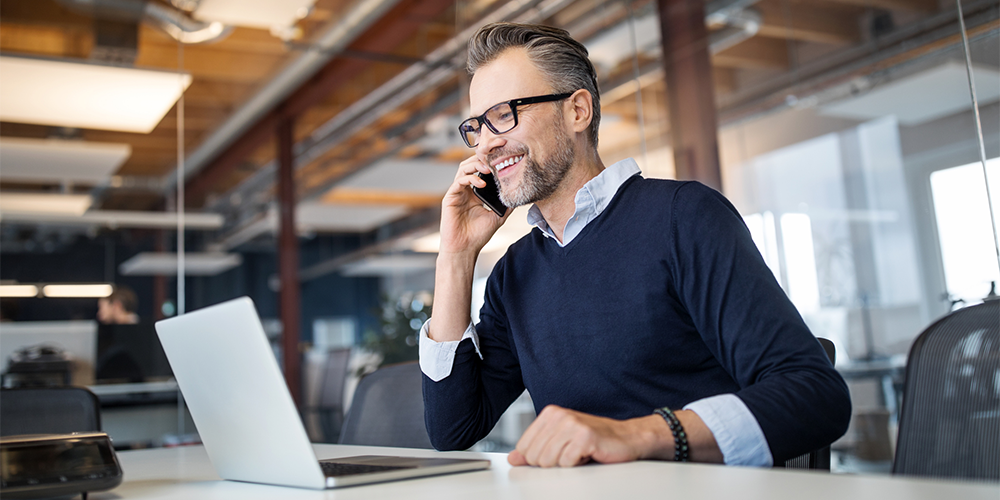 smiling person at computer