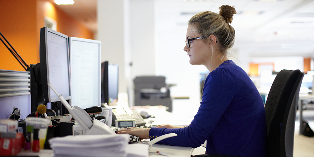 someone sitting and working at a computer