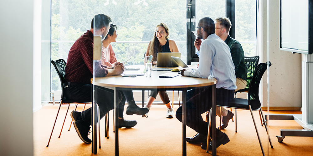 people working at conference table
